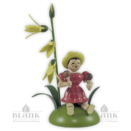 Blumenkind mit Forsythie und Rumbakugel, sitzend