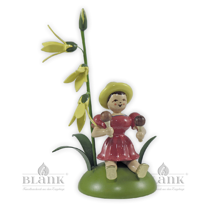 Blumenkind mit Forsythie und Rumbakugel, sitzend